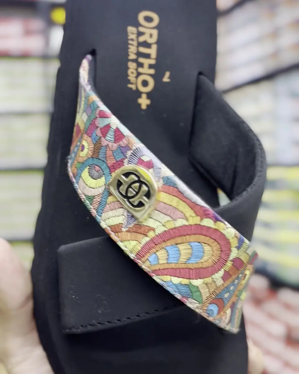 Black comfort sandal with patterned strap